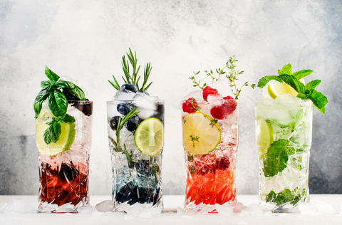 four glasses filled with fruity mocktails.png