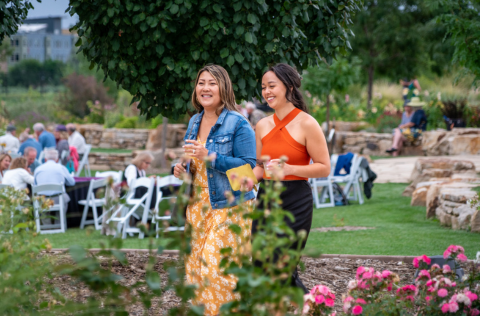 two women walking across the garden
