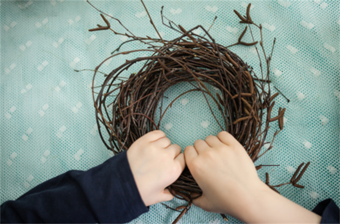 Youth hands making a wreath