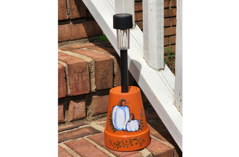 Teracotta solar lights with a fall theme.png